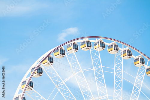 Ferris wheel with beauty blue sky.