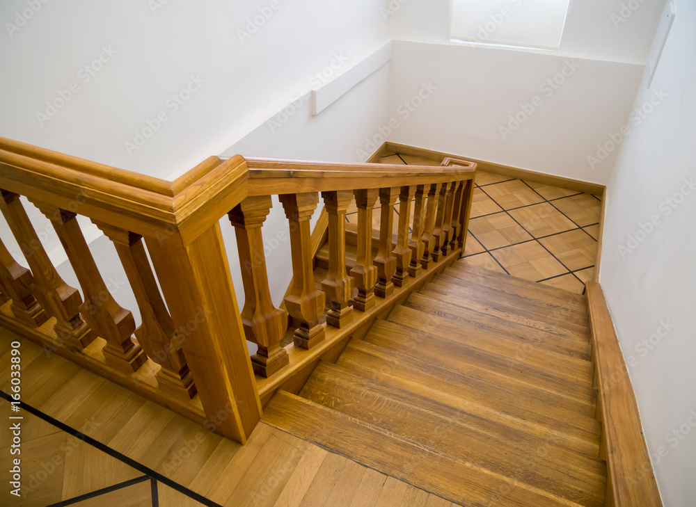 Old wooden staircase with steps going down Old wooden staircase with steps going down