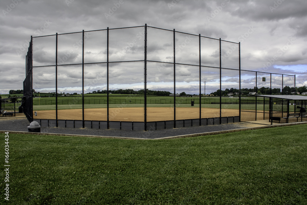 vacant baseball field before a storm