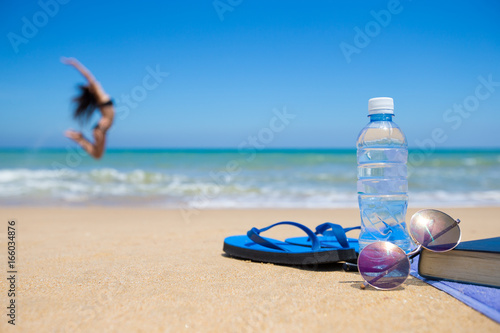 Happy woman relaxes on beach