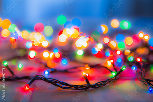 Colored lights Christmas garlands. Colorful abstract background. Blur and bokeh