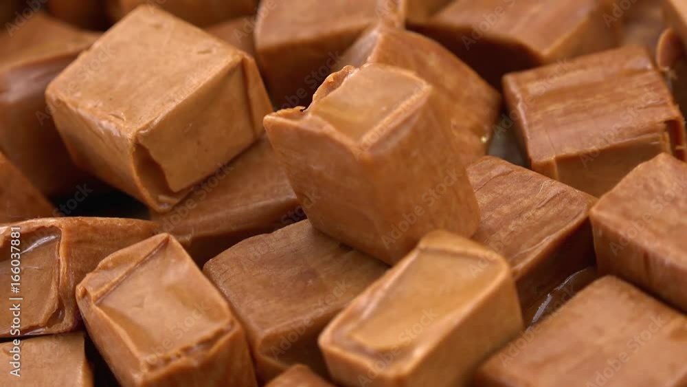 Portion of Caramel rotating on a wooden plate (not loopale; 4K) Portion of Caramel rotating on a wooden plate (not loopale; 4K)