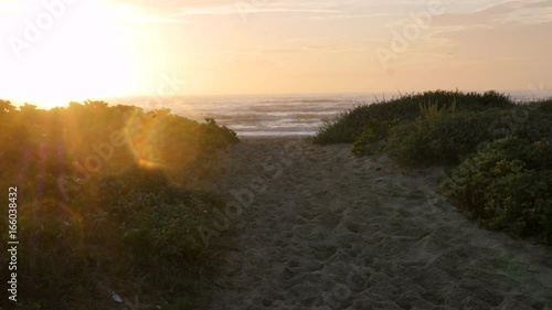 Sunrise Over Beach Dune with Flare on the left photo