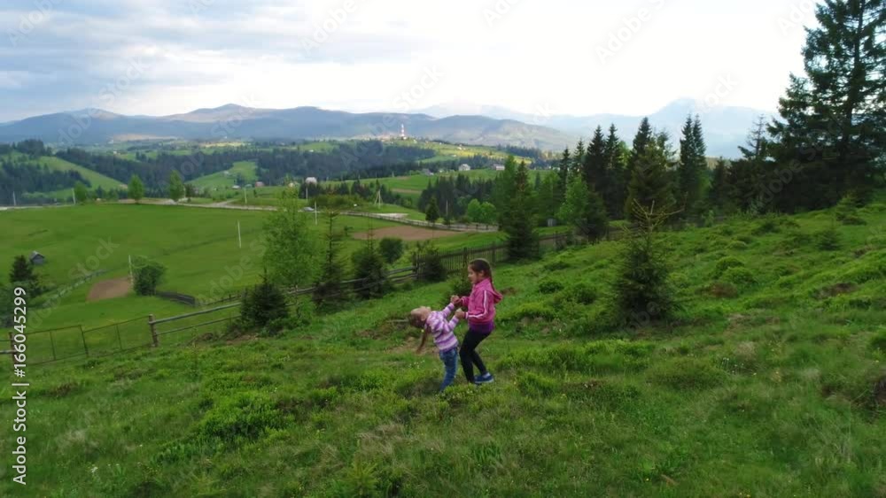 Aerial shot, family walking along, spring day in forest Aerial shot, family walking along, spring day in forest