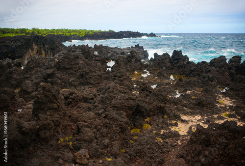 Black beach in Waianapanapa State Park, Maui island photo