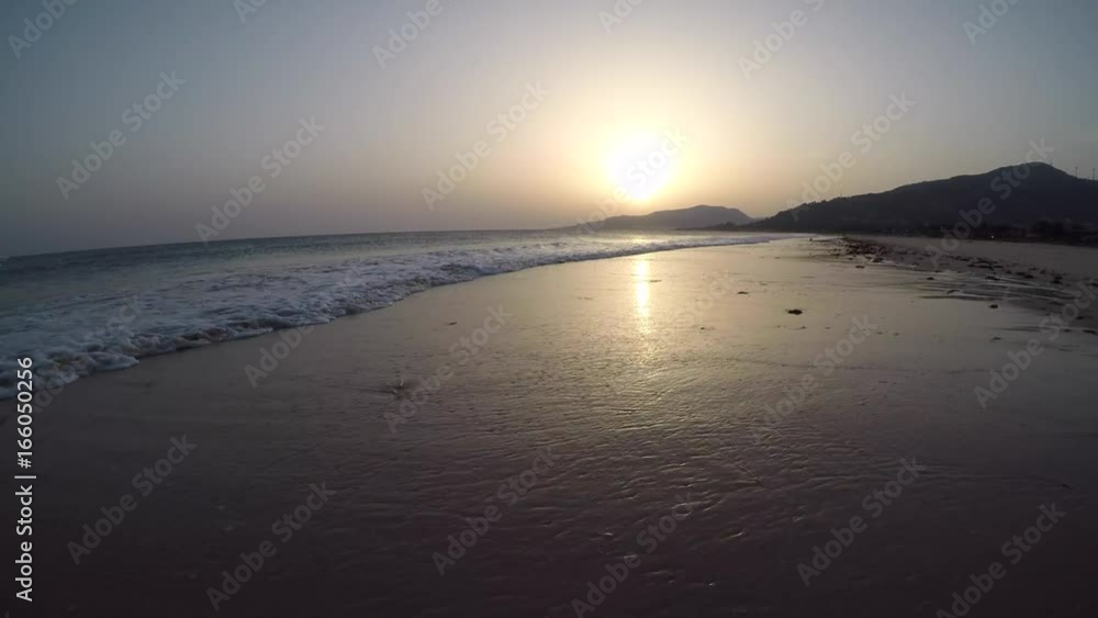4K : Girl walking on the beach at sunset 4K : Girl walking on the beach at sunset