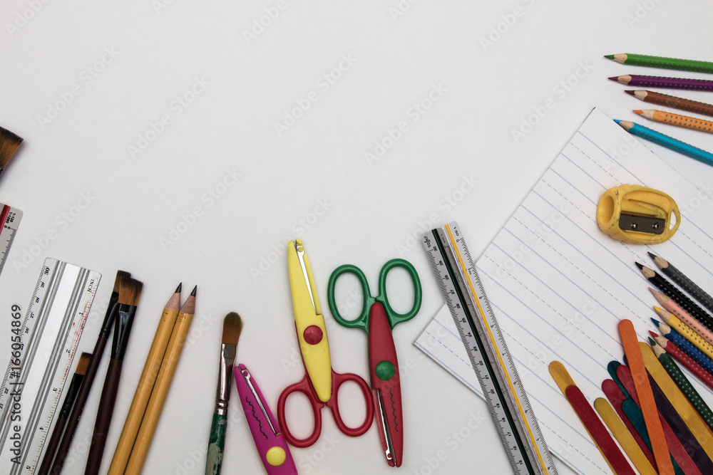 Fototapeta premium Elementary school supplies stationery on white background