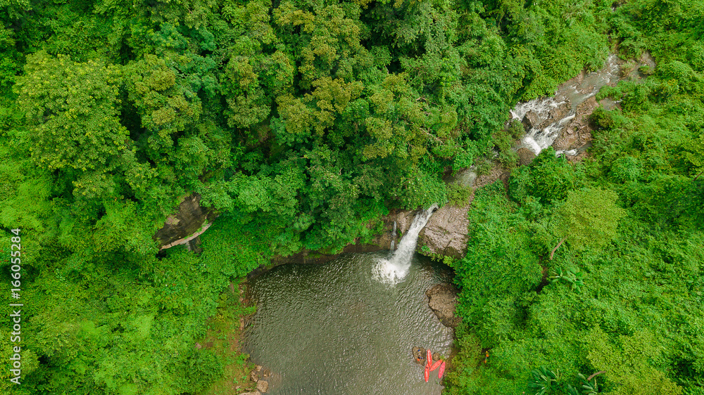 Waterfall in the middle of the forest. Bird eye view , drone