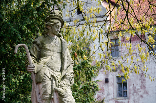 Saint Wendelin as Herdsman, Statue at the castle bridge in Niemodlin, Silesia, Poland photo