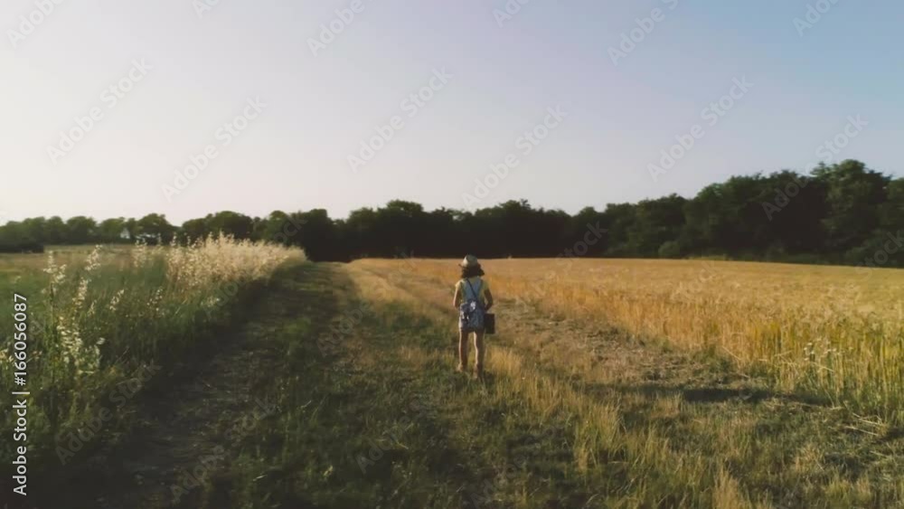 Little Girl with binoculars walking in open field Little Girl with binoculars walking in open field