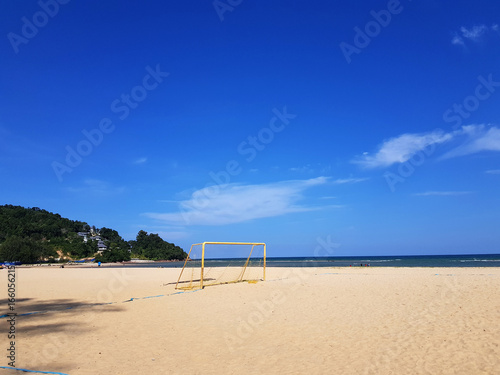 Fototapeta Naklejka Na Ścianę i Meble -  Beach and blue sky / A beach is a land along a body of water. It usually consists of loose particles, which are often composed of rock, such as sand, gravel, shingle, pebbles