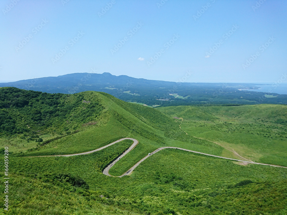 S curve road on mountain with blue sky