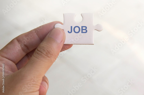 jigsaw puzzle with JOB word , look for job concept