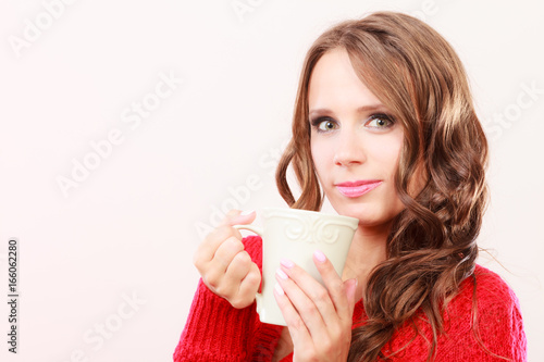 Autumn woman holds mug with coffee warm beverage