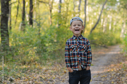 happy boy in autumn forest © androsov858