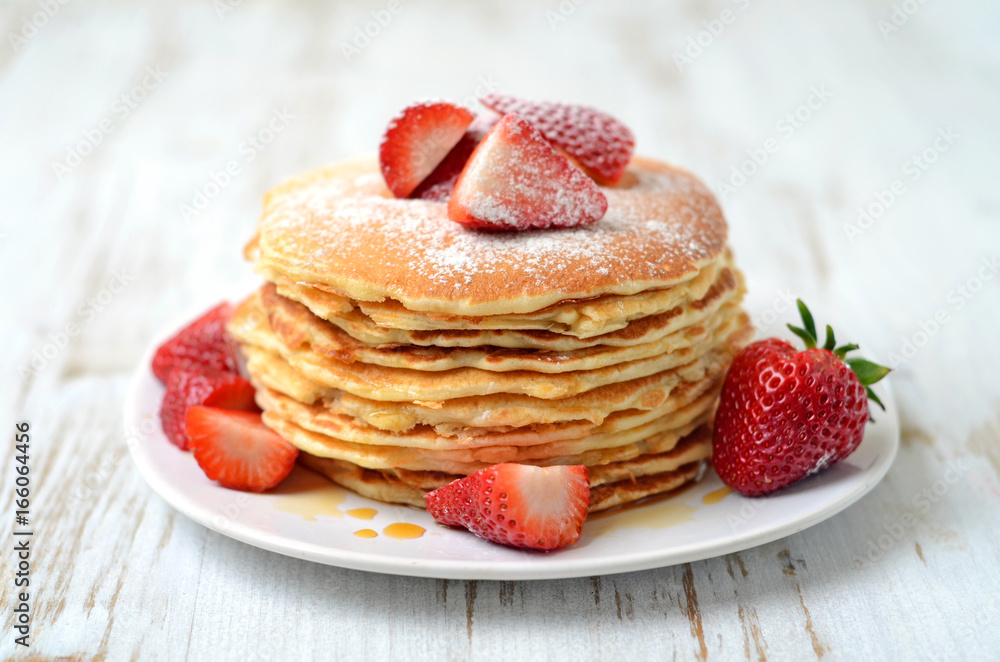 freshly prepared pancakes with strawberries freshly prepared pancakes with strawberries