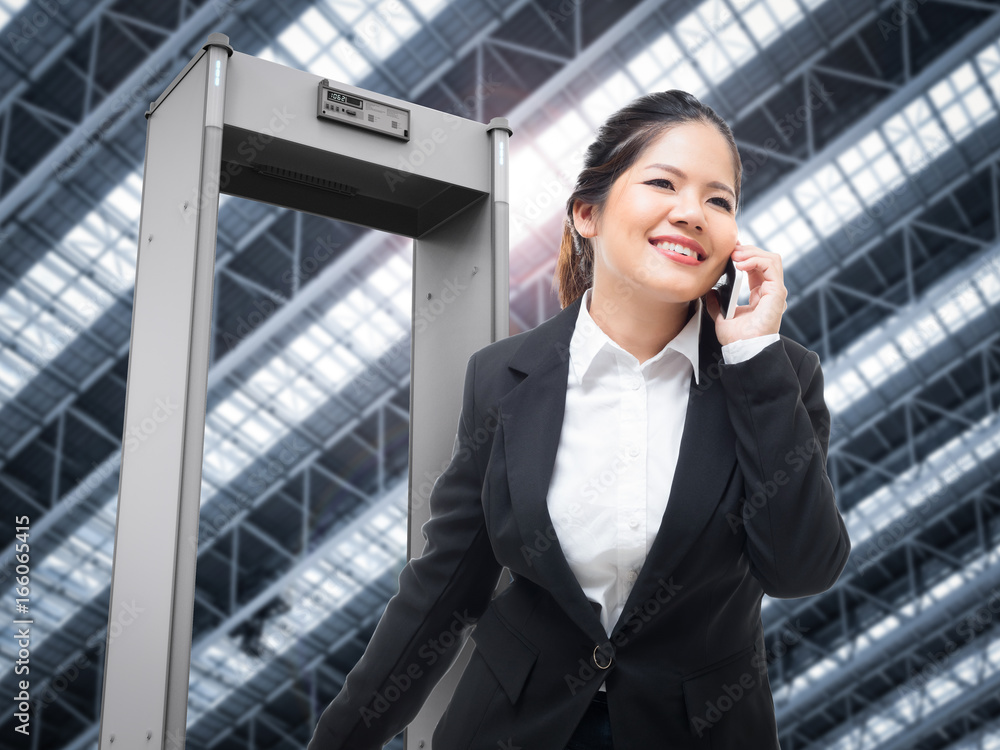 businesswoman walk through security gate businesswoman walk through security gate