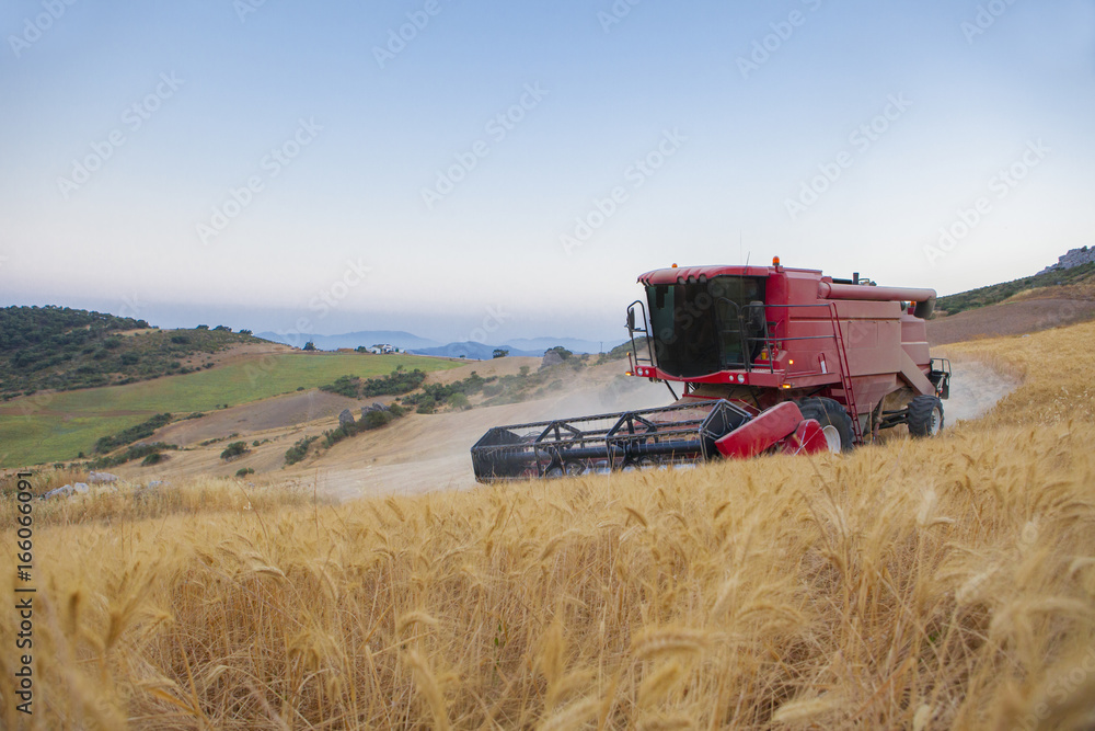 Obraz premium Combine at turning maneuver on mountain range area, Antequera, Malaga