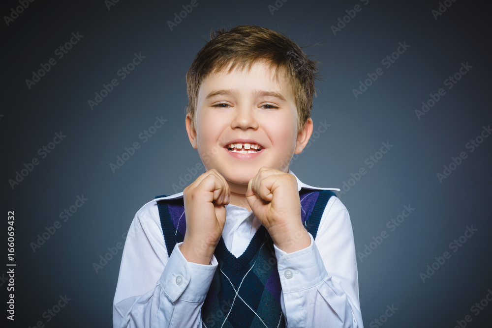 Closeup portrait successful happy boy isolated grey background. Closeup portrait successful happy boy isolated grey background.