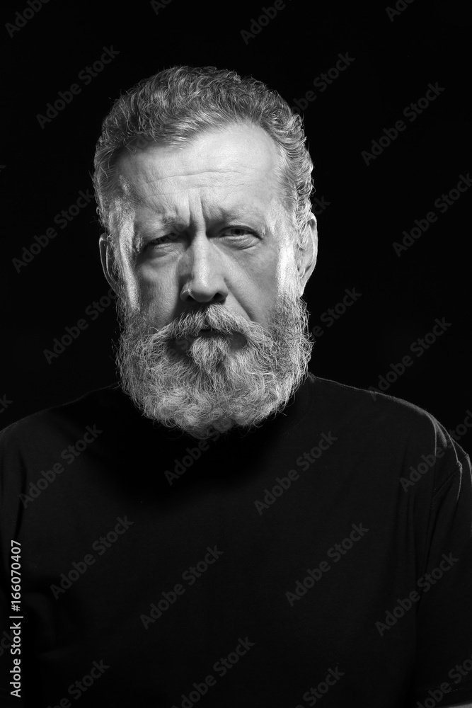 Handsome elderly man on black background Handsome elderly man on black background