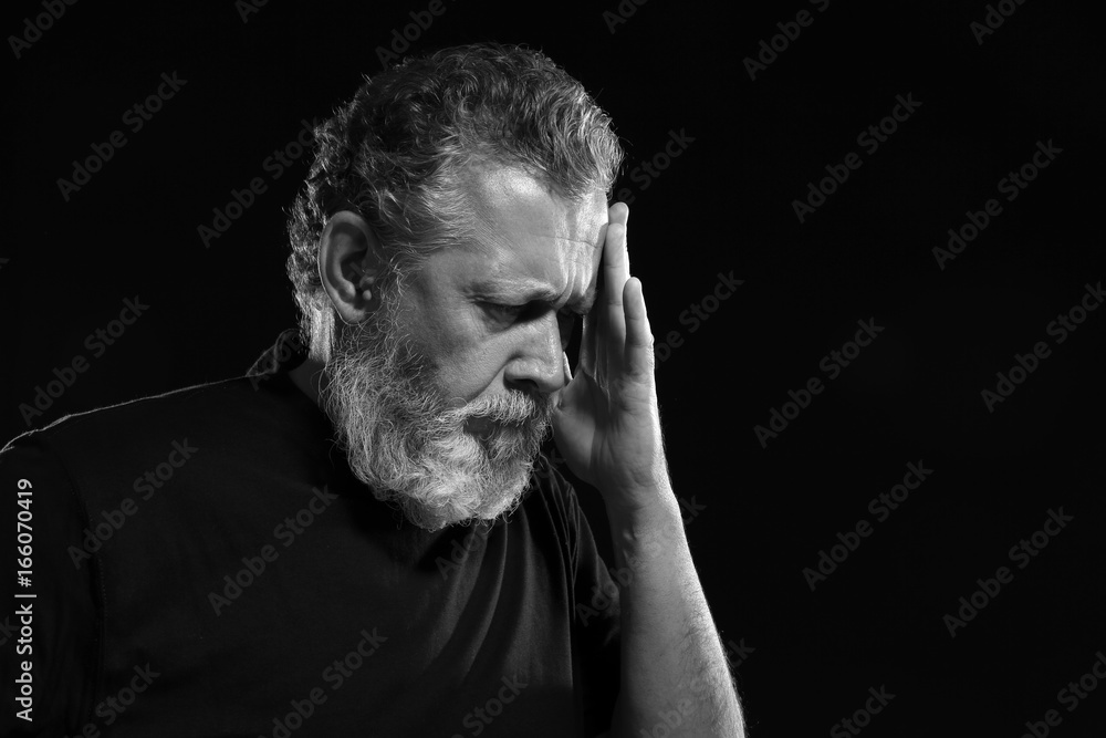 Handsome elderly man on black background Handsome elderly man on black background