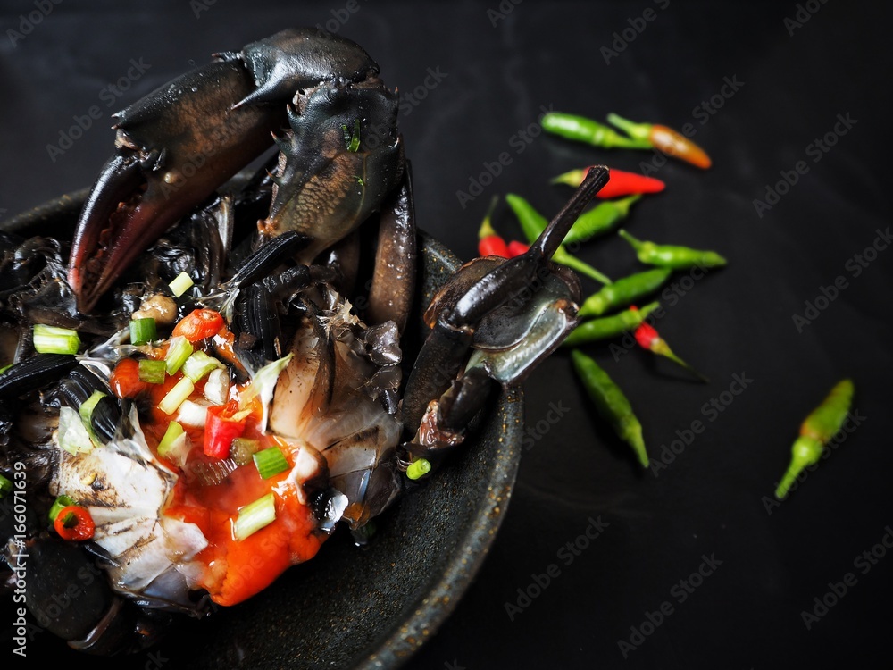 Soy sauce marinated crab Korean food on black background Soy sauce marinated crab Korean food on black background
