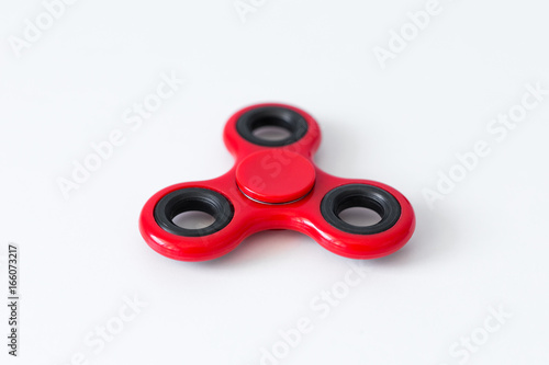 close up of popular toy fidget spinner over white table