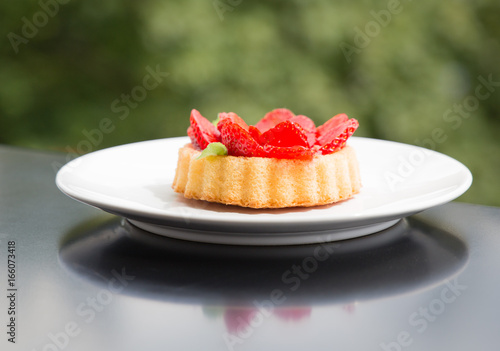 Valokuvatapetti Red Strawberry tart sweet desert shortcake on a plate macro closeup