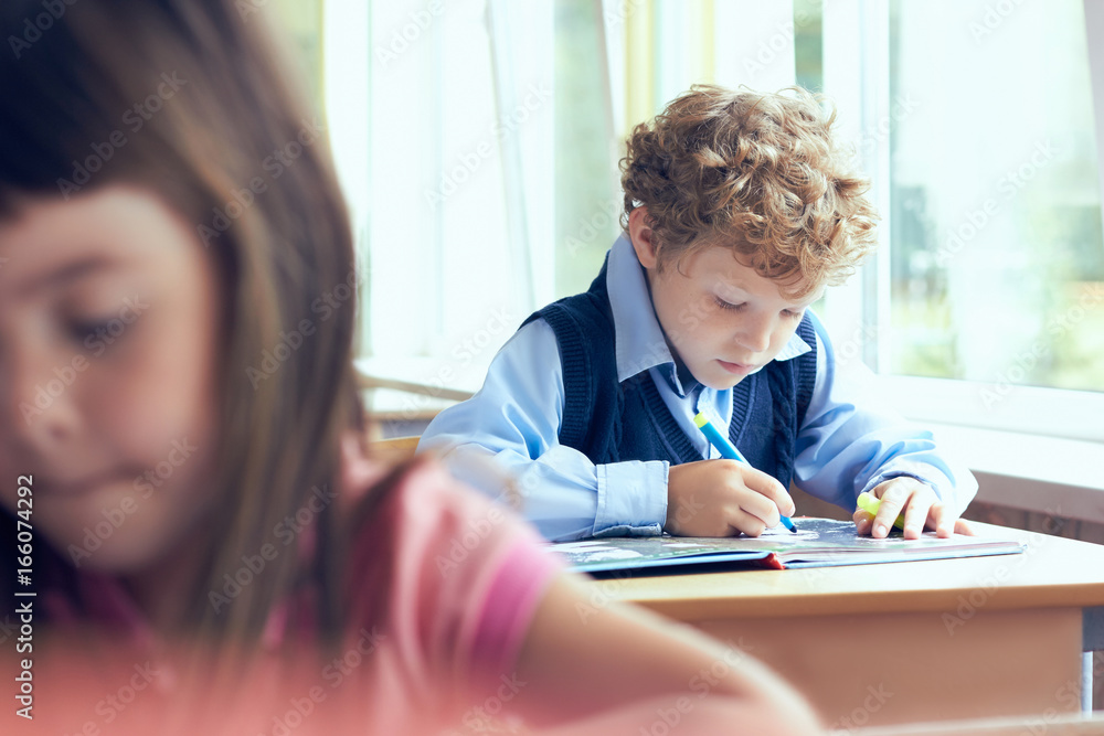 Little boy is doing his homework for elementary school. Little boy is doing his homework for elementary school.
