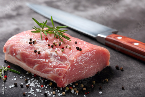 Raw pork loin with spices photo