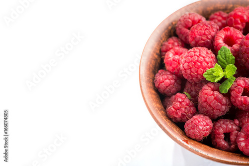 ripe raspberry on bowl isolated