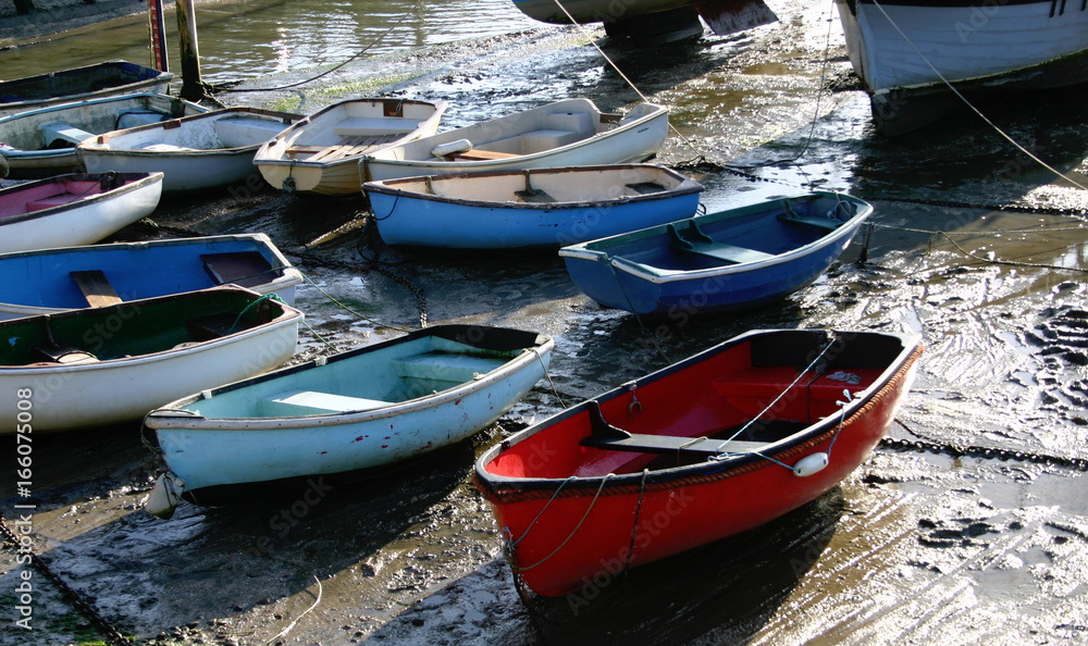 Boats at low tide on the English coast, resting from countless hours at sea