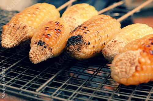 grilled corn, hot corncob