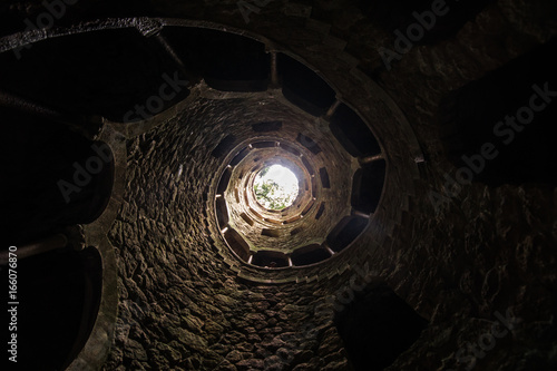 The Initiation well of Quinta da Regaleira in Sintra. The depth of the well is 27 meters. It connects with other tunnels through underground passages. Sintra. Portugal photo