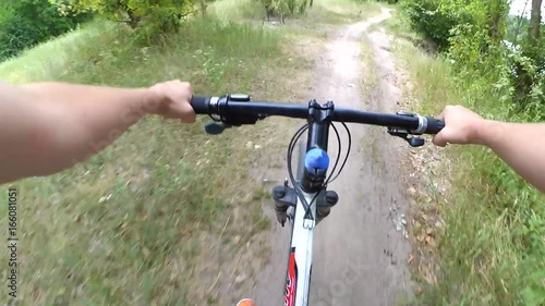 Fast cycling on a forest path. Action camera go pro.