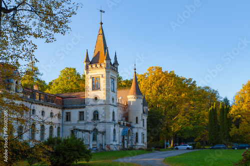 Old fairy-tale palace in Stameriena, Latvia. Fall time, bright colors at sunset