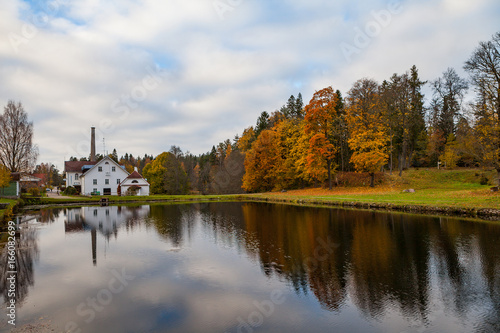Palmse distillery and hotel reflection in water of pond, Estonia © yegorov_nick