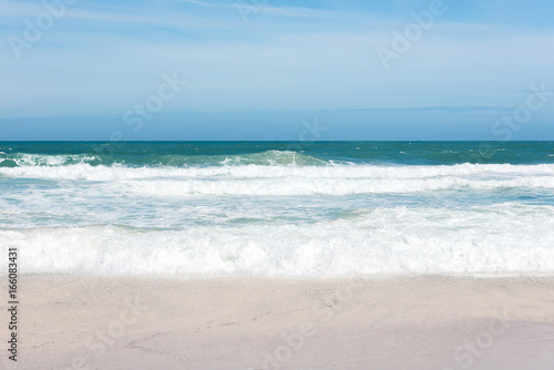 Sea view from tropical beach with sunny sky © kitthanes