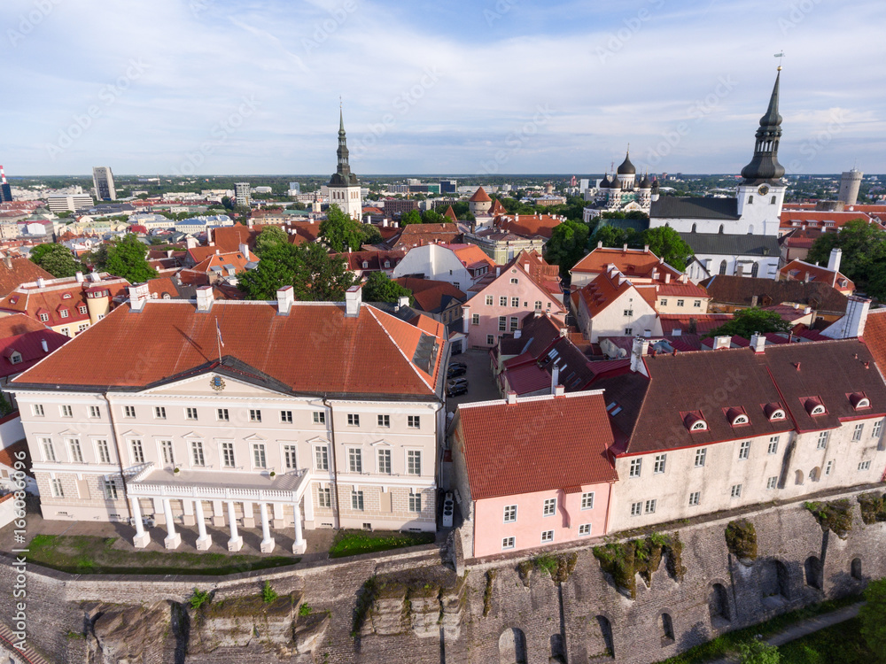 Obraz premium Building of government of Estonia and Church of St. Nicholas on background. The Old Town of Tallinn. Aerial view. Estonia, Europe