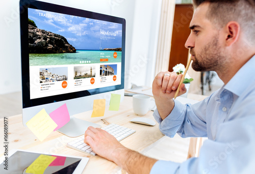 Young worker looking holiday webs