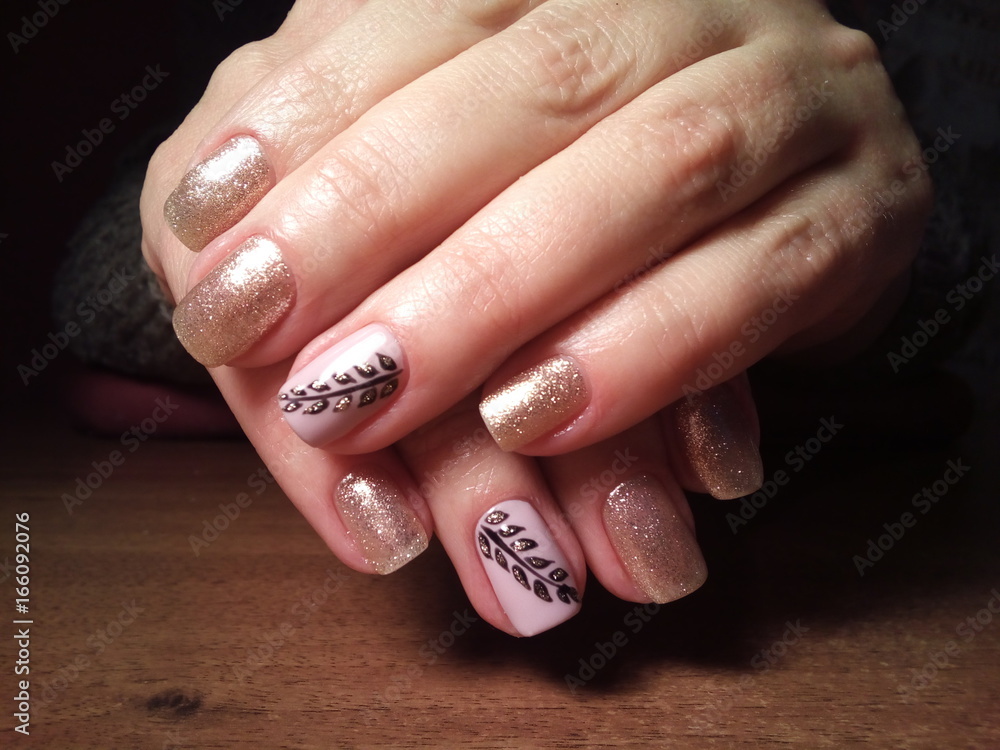 The manicurist excellently made her work a beautiful manicure with a polish gel on her hands and the client is happy The manicurist excellently made her work a beautiful manicure with a polish gel on her hands and the client is happy