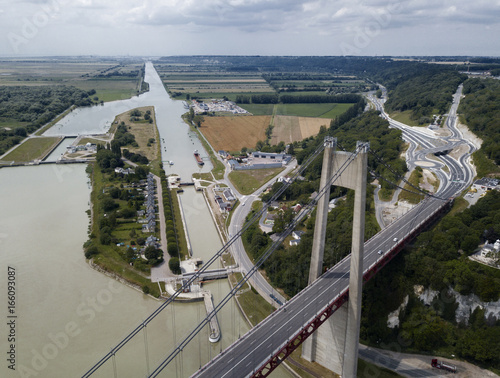 Aerial view of a Tancarville channel with brirge and highway, France photo