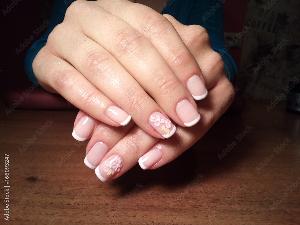 The manicurist excellently made her work a beautiful manicure with a polish gel on her hands and the client is happy The manicurist excellently made her work a beautiful manicure with a polish gel on her hands and the client is happy