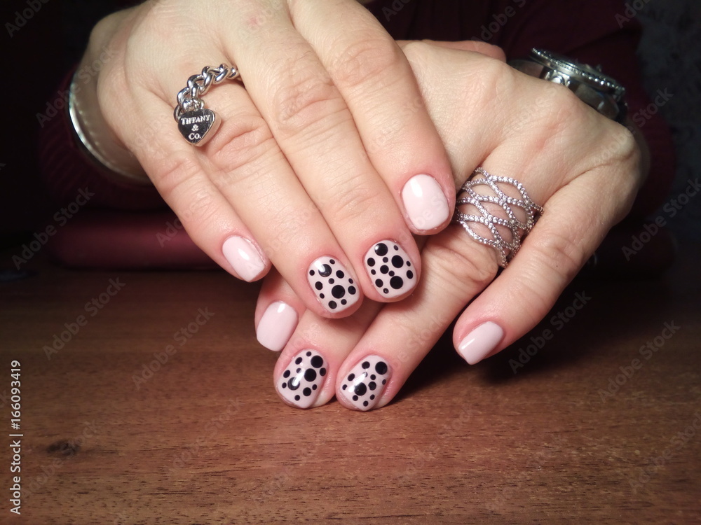 The manicurist excellently made her work a beautiful manicure with a polish gel on her hands and the client is happy The manicurist excellently made her work a beautiful manicure with a polish gel on her hands and the client is happy
