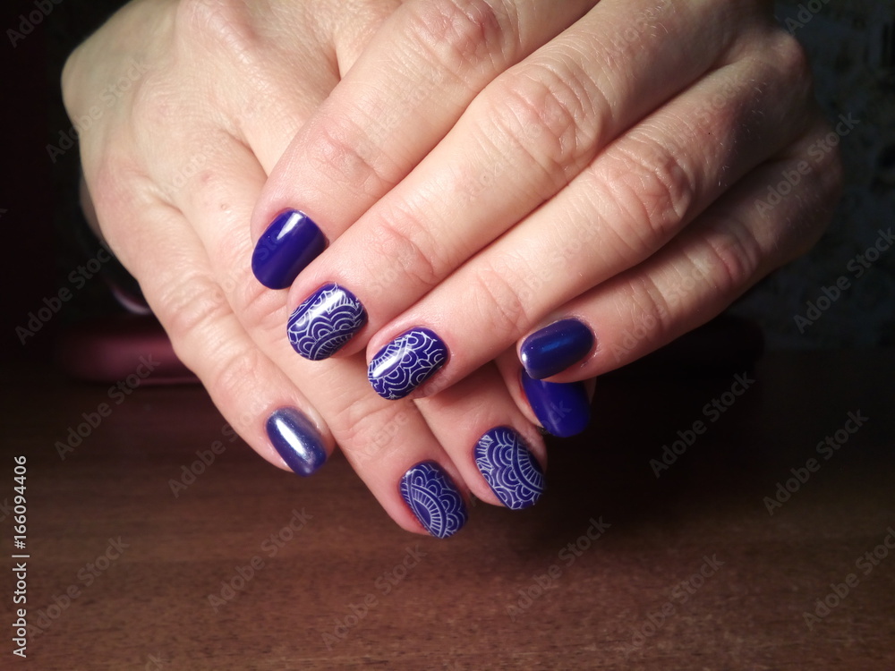 The manicurist excellently made her work a beautiful manicure with a polish gel on her hands and the client is happy The manicurist excellently made her work a beautiful manicure with a polish gel on her hands and the client is happy