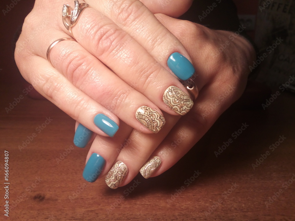 The manicurist excellently made her work a beautiful manicure with a polish gel on her hands and the client is happy The manicurist excellently made her work a beautiful manicure with a polish gel on her hands and the client is happy