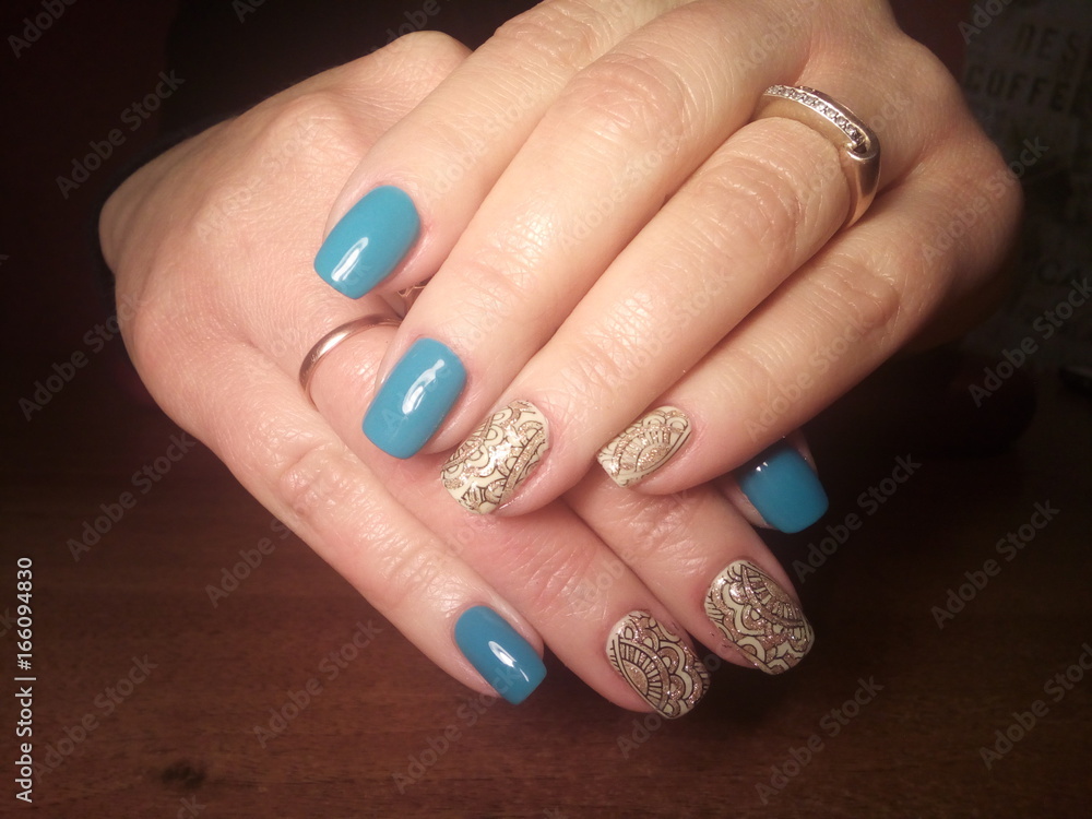 The manicurist excellently made her work a beautiful manicure with a polish gel on her hands and the client is happy The manicurist excellently made her work a beautiful manicure with a polish gel on her hands and the client is happy
