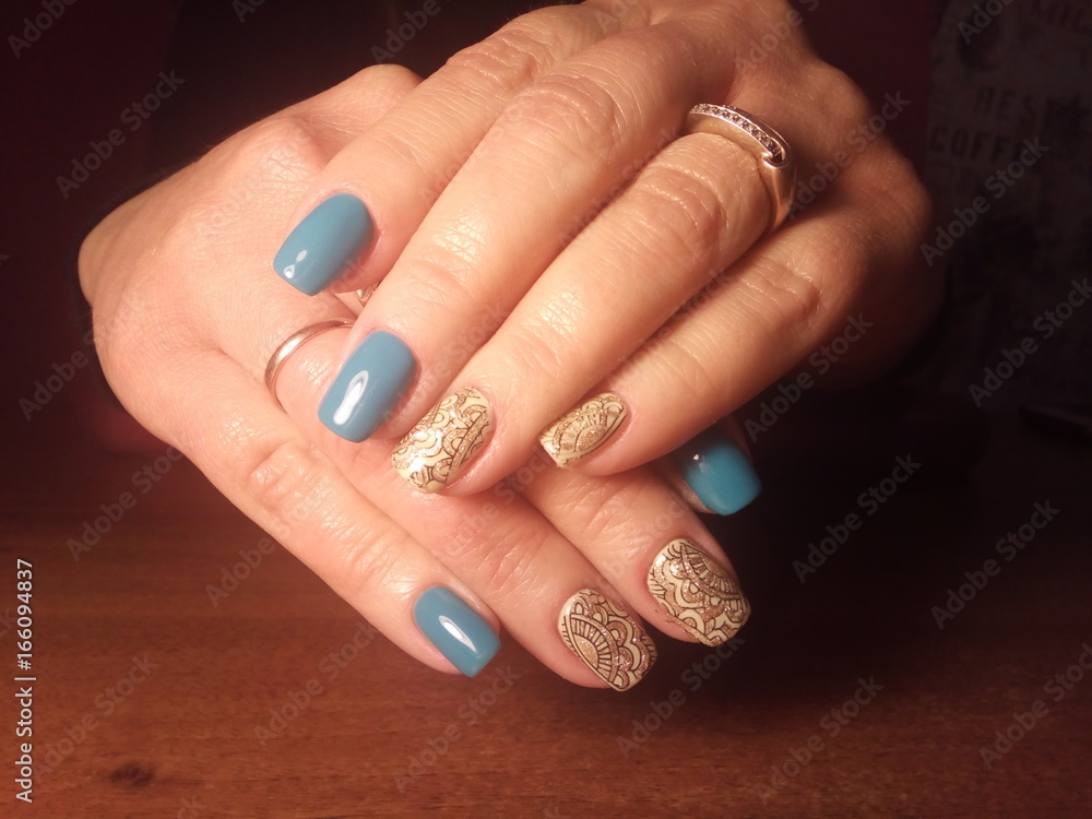 The manicurist excellently made her work a beautiful manicure with a polish gel on her hands and the client is happy The manicurist excellently made her work a beautiful manicure with a polish gel on her hands and the client is happy