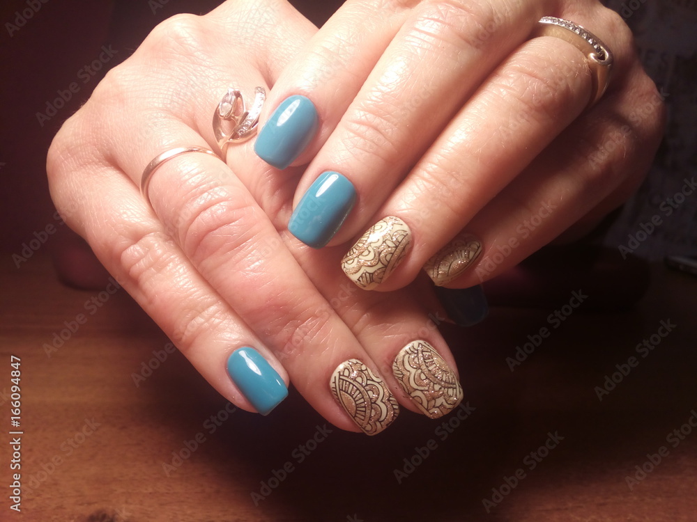 The manicurist excellently made her work a beautiful manicure with a polish gel on her hands and the client is happy The manicurist excellently made her work a beautiful manicure with a polish gel on her hands and the client is happy