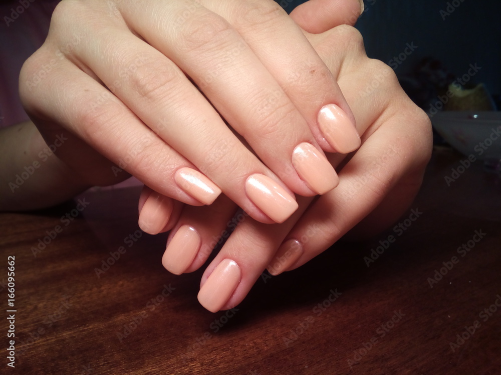 The manicurist excellently made her work a beautiful manicure with a polish gel on her hands and the client is happy The manicurist excellently made her work a beautiful manicure with a polish gel on her hands and the client is happy